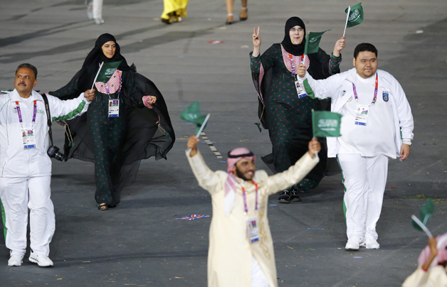 Members of Saudi Arabia's contingent take part in athletes parade during opening ceremony of London 2012 Olympic Games at Olympic Stadium